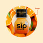 Sip Elixirs Citrus Spark Energy drink bottle surrounded by orange slices on a beige background